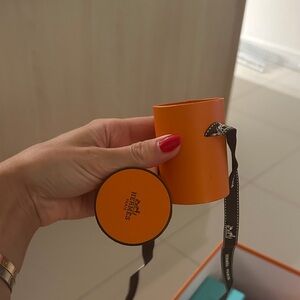 Hermes Orange Round Box with Black Ribbon